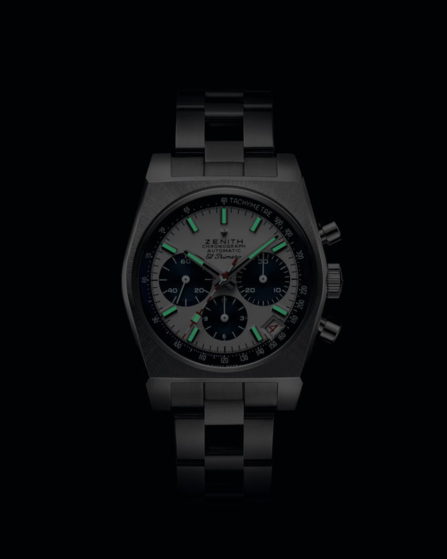 Black watch with green accents on a black background