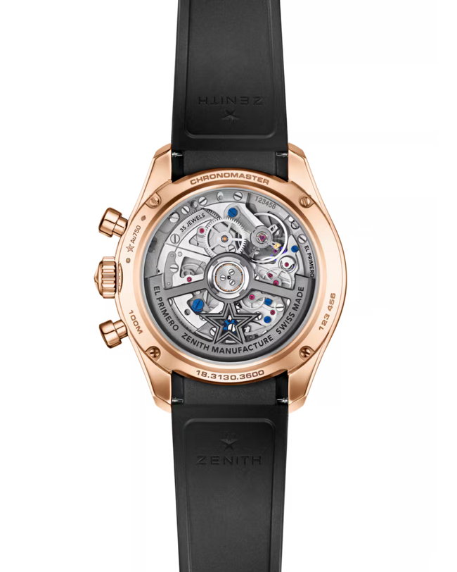 Rose gold chronograph watch with exposed movement visible through transparent caseback and black rubber strap.