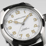 Close-up of the Hamilton Khaki Field Murph 38mm, featuring a white textured dial, gold-tone numerals and hands, and a black leather strap—a must-have vintage-inspired piece for Hamilton fans.