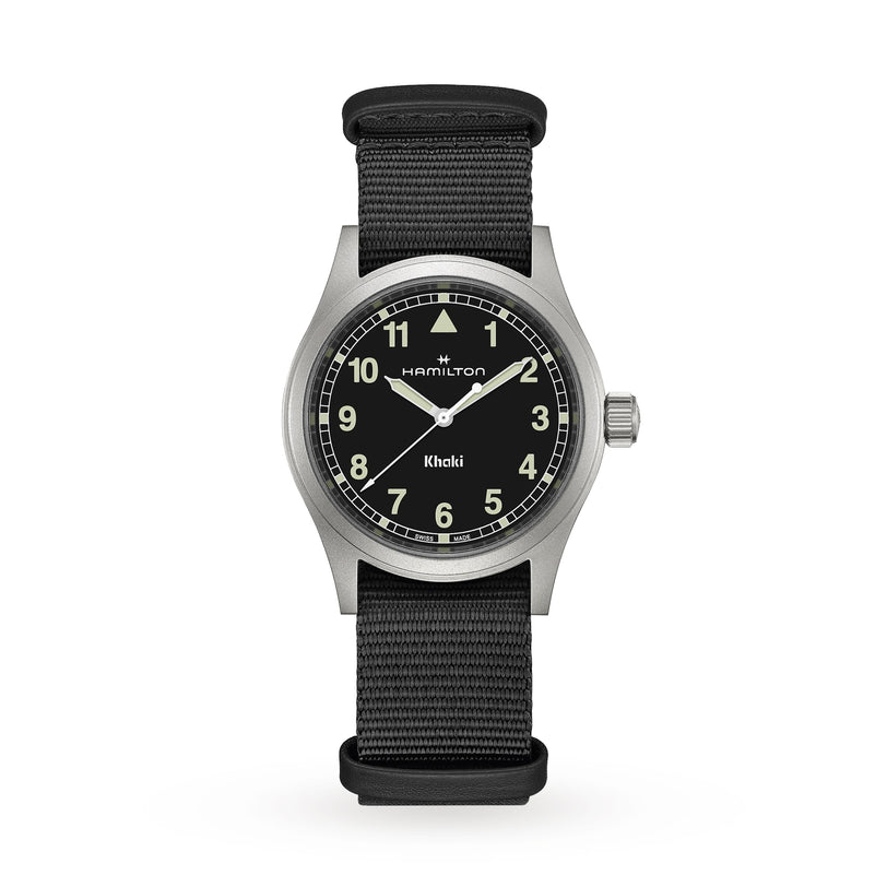 The Hamilton Khaki Field Quartz features a black dial with white numerals and a black fabric strap.