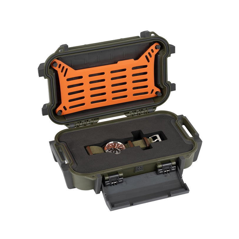An open green hard case with foam padding displays the Hamilton x Call of Duty Black Ops 7 by Hamilton, a Swiss-made watch. The orange interior lid of the case features ventilation holes.