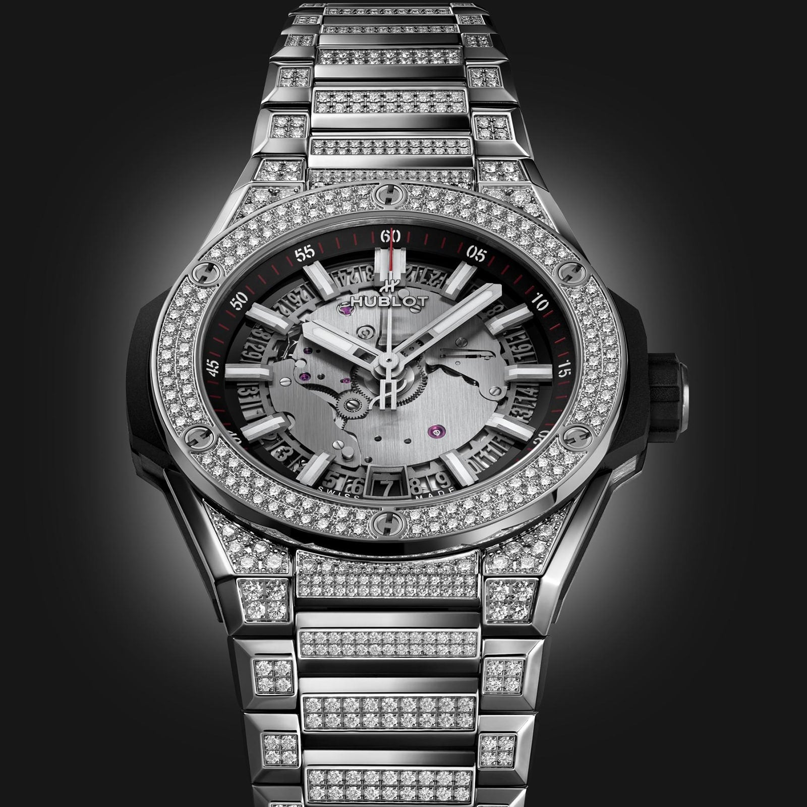 The Hublot Big Bang Integrated Time Only Titanium Pavé is a luxury watch with a titanium case and metal band set with diamonds, plus a partially skeletonized dial and visible gears, inspired by the Big Bang Integrated Time collection.