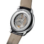 Close-up of the Girard-Perregaux 1966 40, showcasing its exceptional automatic movement and engravings through a transparent case back in polished stainless steel.