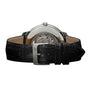 Close-up of the Girard-Perregaux 1966 40, highlighting its mechanical movement through the stainless steel case back and its black leather strap with metal buckle.
