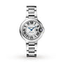 The Ballon Bleu de Cartier watch by Cartier features a silver guilloché dial with Roman numerals, blue hands, and a round face, plus a metal bracelet and a crown adorned with a blue gem.