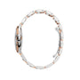 Side view of the Ballon Bleu de Cartier watch by Cartier, showcasing a two-tone silver and rose gold linked bracelet with a closed clasp.