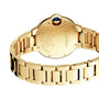 Close-up of the Ballon Bleu de Cartier by Cartier, highlighting the engraved details on its yellow gold case back and the linked gold bracelet.