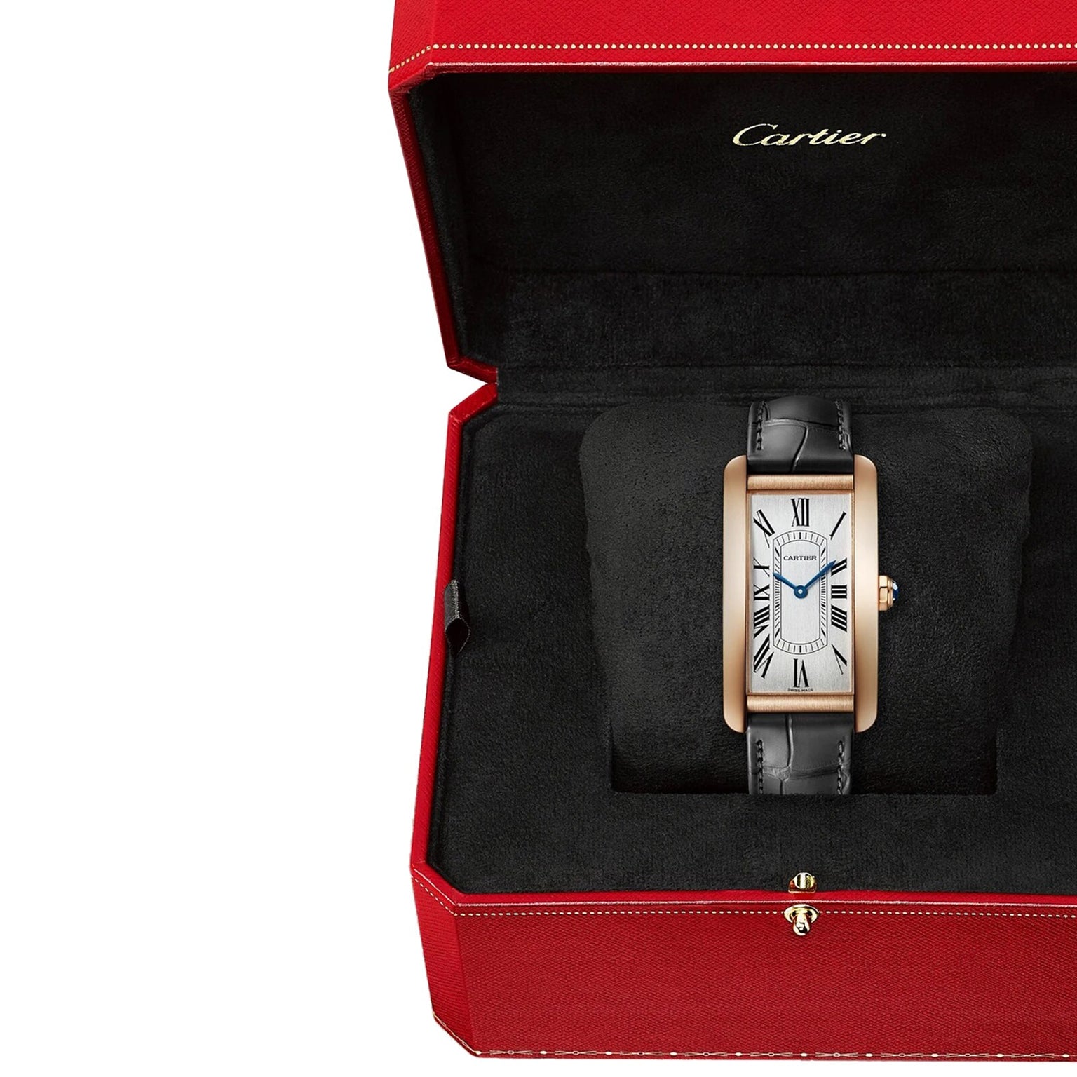 A Cartier Tank Américaine wristwatch with a rectangular face and black leather strap, set in a rose gold case and displayed in an open red Cartier box.