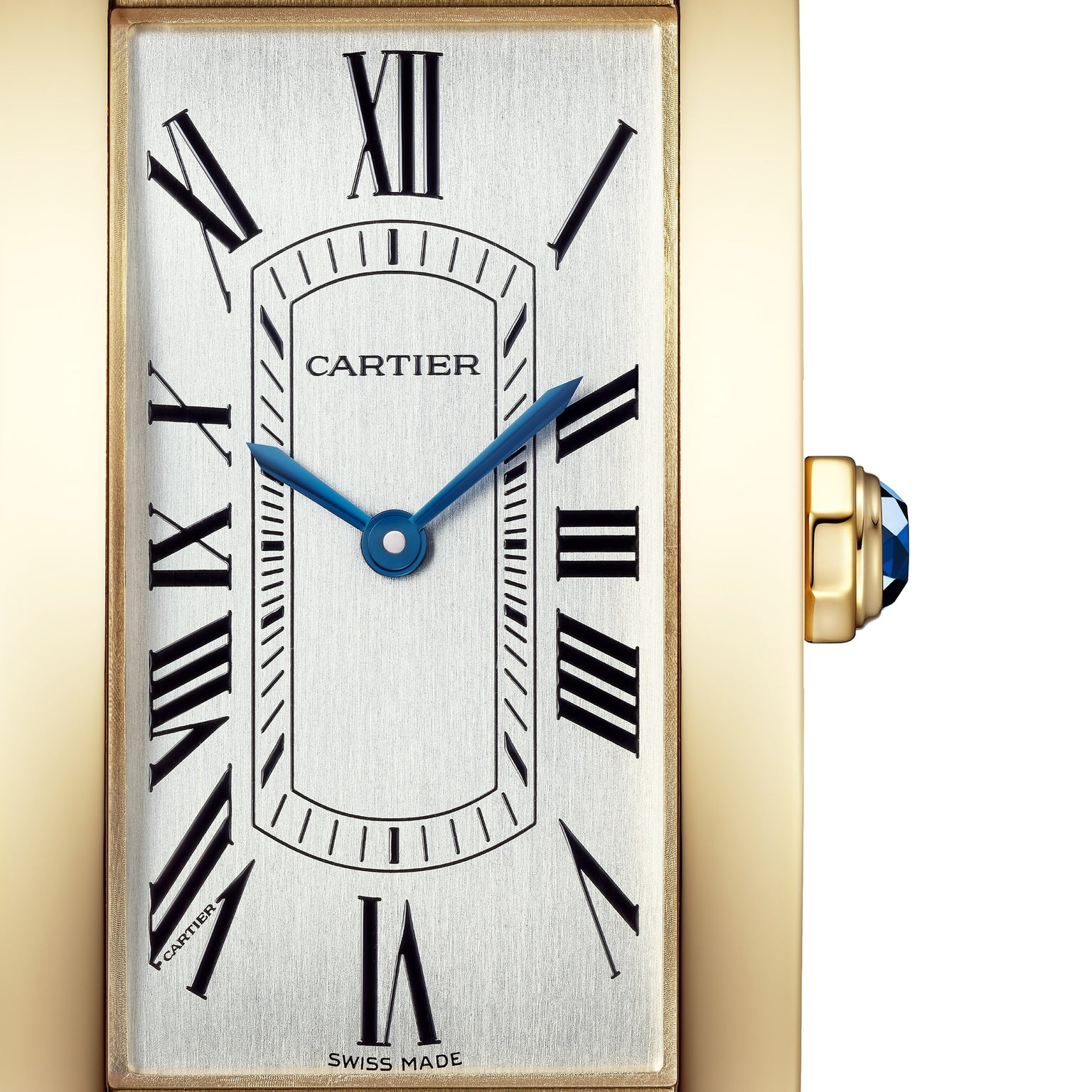 Close-up of the Cartier Tank Américaine watch face, featuring Roman numerals and blue hands in a gold rectangular case.