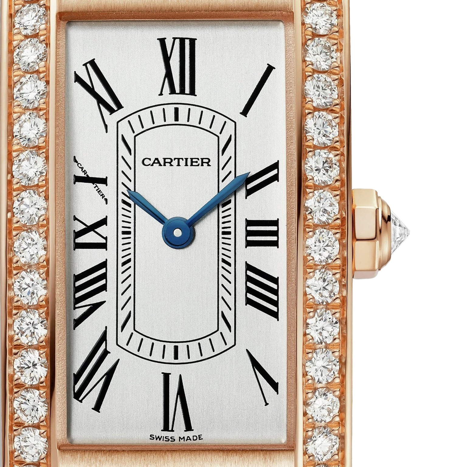 Close-up of the Cartier Tank Américaine watch featuring a rectangular face, rose gold case, diamond-encrusted bezel, Roman numeral markers, and blue hands.