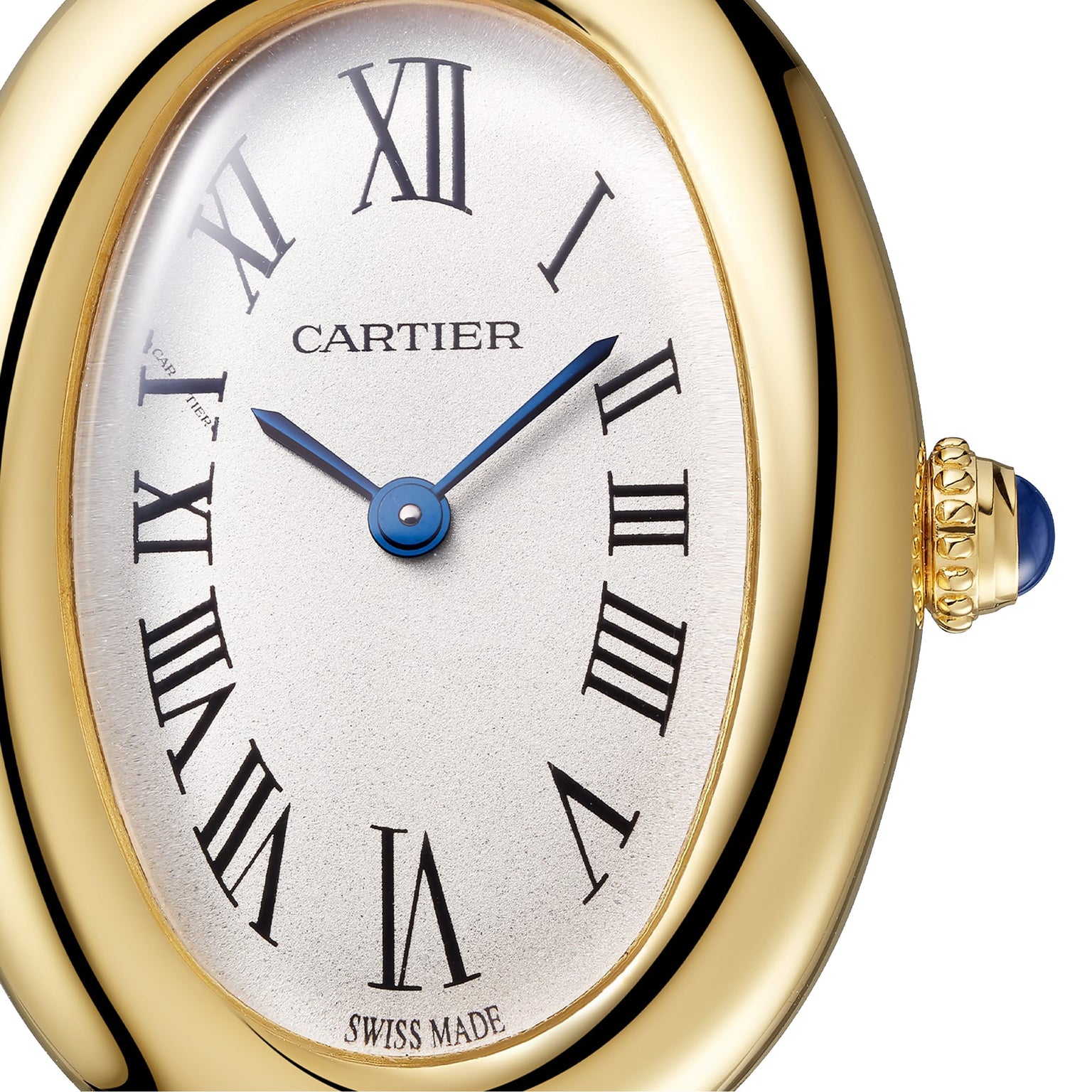 Close-up of the Cartier Baignoire watch, featuring an 18K yellow gold oval case, blue hands, Roman numeral hour markers, and a crown adorned with a blue cabochon gemstone.