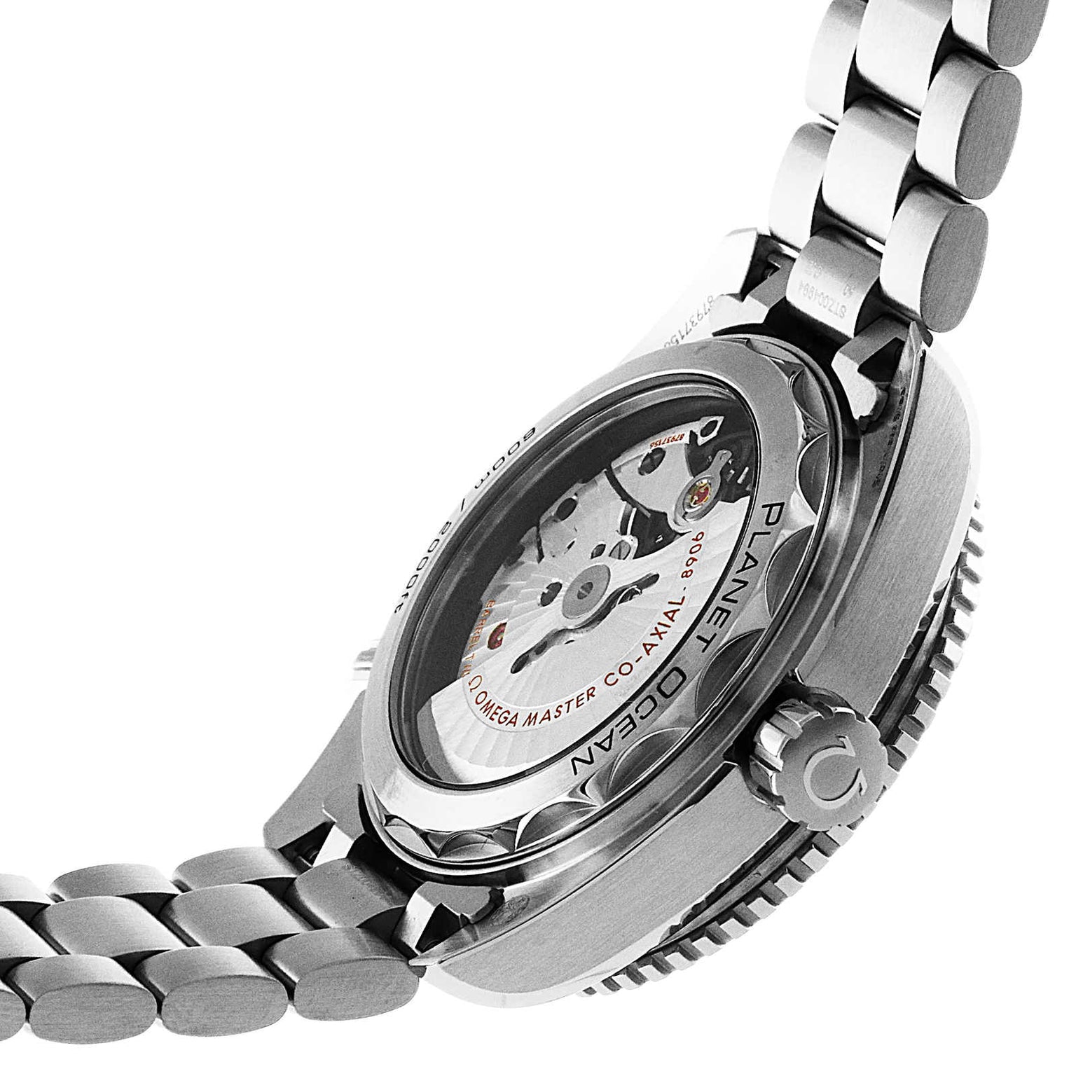 The image shows the back of the OMEGA Seamaster Planet Ocean 600M with a stainless steel bracelet and its automatic Master Chronometer movement visible through a transparent case back.