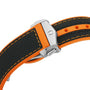Close-up of a black and orange textured dive watch strap with orange stitching and a silver clasp engraved with C—ideal for pairing with your OMEGA Seamaster Planet Ocean 600M or any Master Chronometer.
