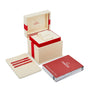 An open OMEGA watch box with a cushion, card holder set, and operating instructions booklet—ideal for displaying your cherished De Ville Tresor 36.