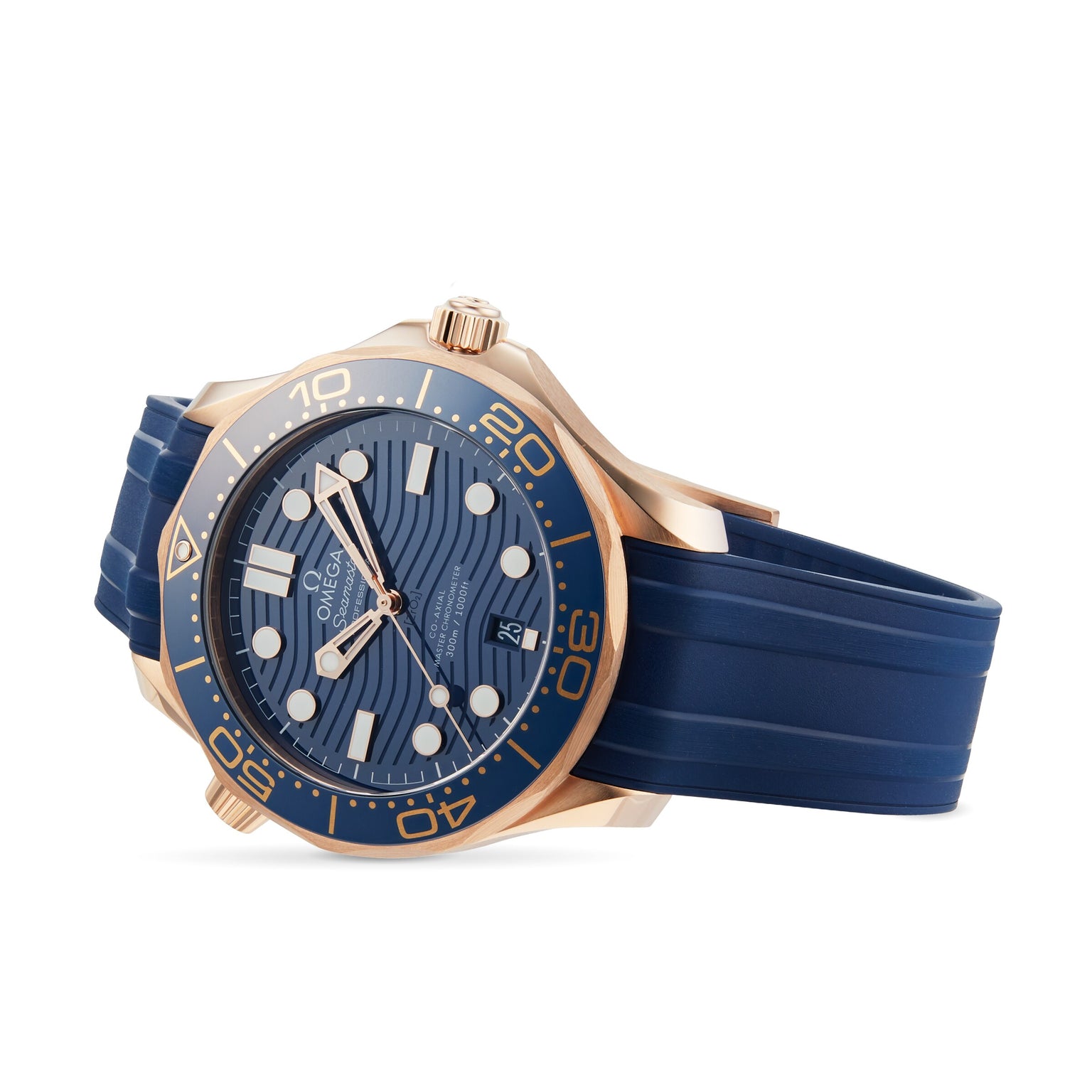 The OMEGA Seamaster Diver 300M in gold and blue boasts a wave-pattern blue dial, gold bezel, and blue rubber strap, channeling James Bond style and elegantly displayed at an angle.