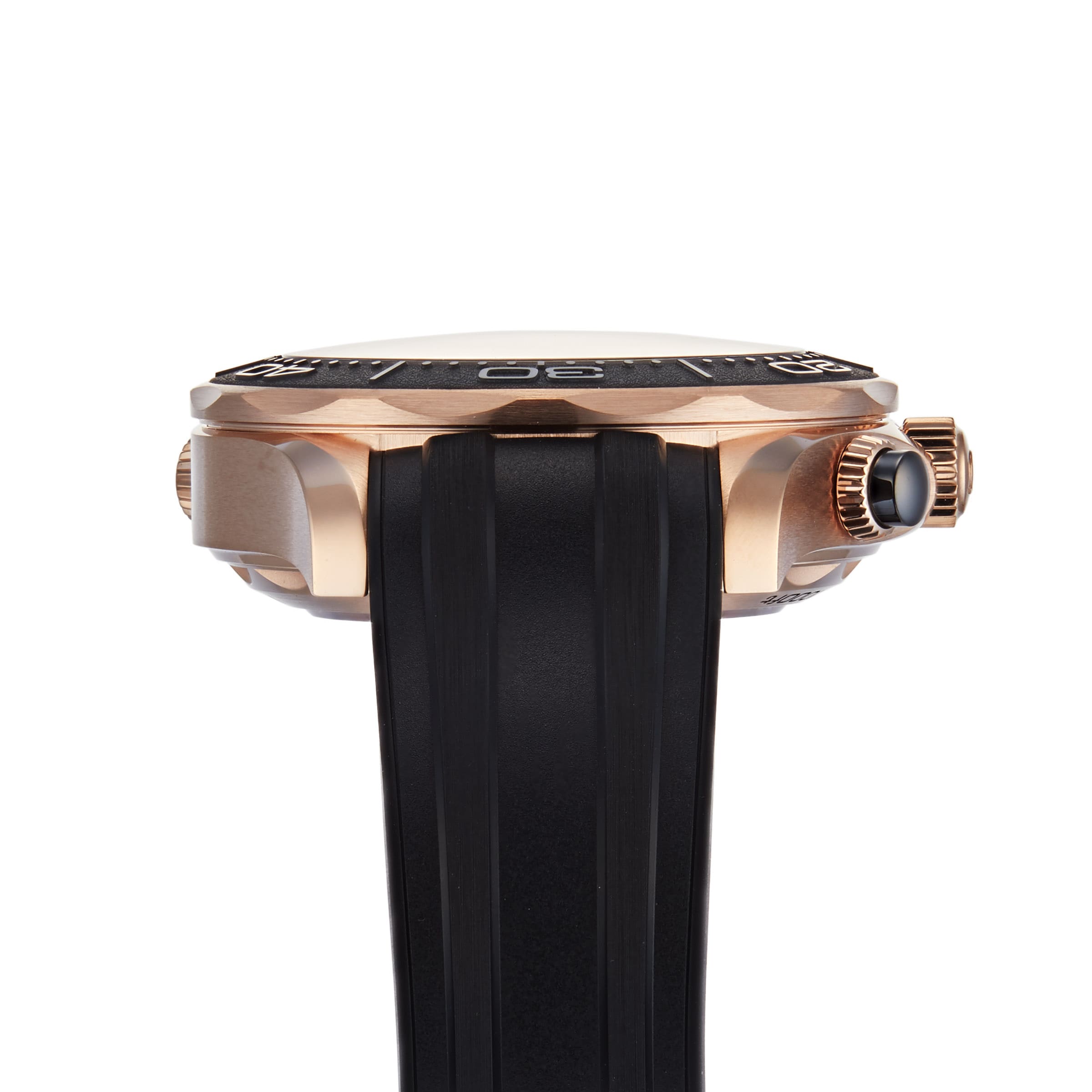 Side view of the OMEGA Seamaster Diver 300M gold watch featuring a black rubber strap, black bezel, and a ridged crown on the right.