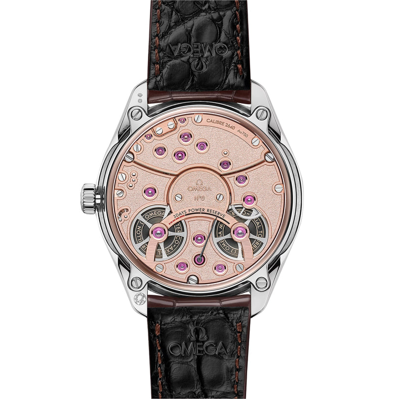 The image shows the back of the OMEGA De Ville Tourbillon featuring an exposed rose-gold mechanical movement with decorative jewels and a black leather strap embossed with the OMEGA logo.
