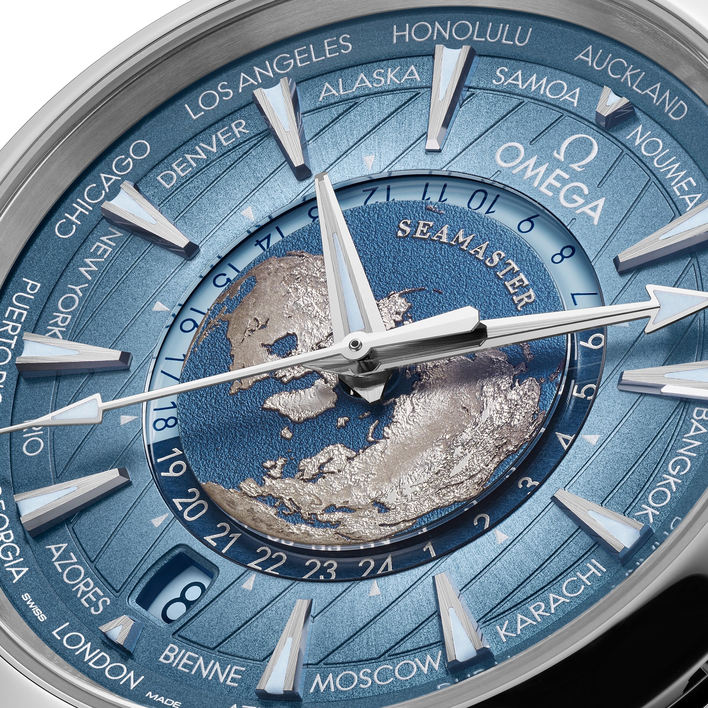 Close-up of the OMEGA Seamaster Aqua Terra 150M watch face, featuring multiple time zones, city names on the outer rim, and a detailed map design centered within its stainless steel case.