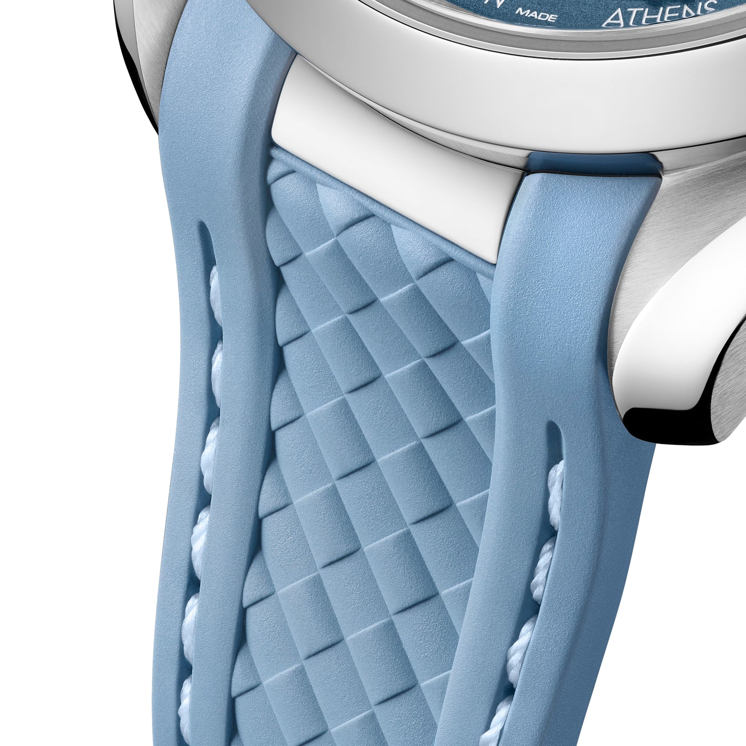Close-up of a light blue strap with a textured, diamond-patterned center and smooth edges, attached to the OMEGA Seamaster Aqua Terra 150M stainless steel case.