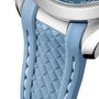 Close-up of a light blue strap with a textured, diamond-patterned center and smooth edges, attached to the OMEGA Seamaster Aqua Terra 150M stainless steel case.