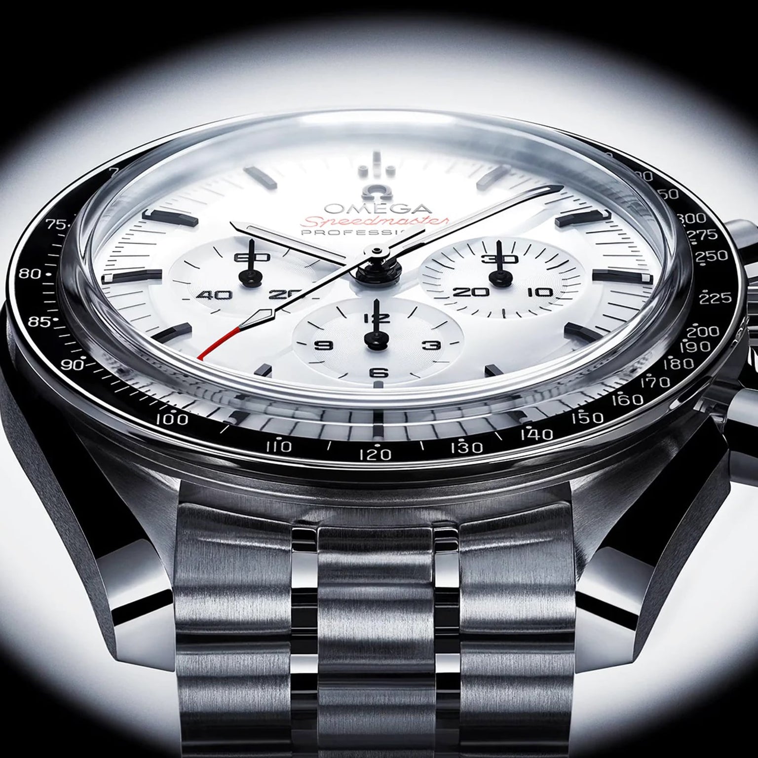 Close-up of the OMEGA Speedmaster Moonwatch Professional, showcasing a white dial, black bezel, three subdials, stainless steel bracelet, and powered by the precise Omega 3861 calibre.