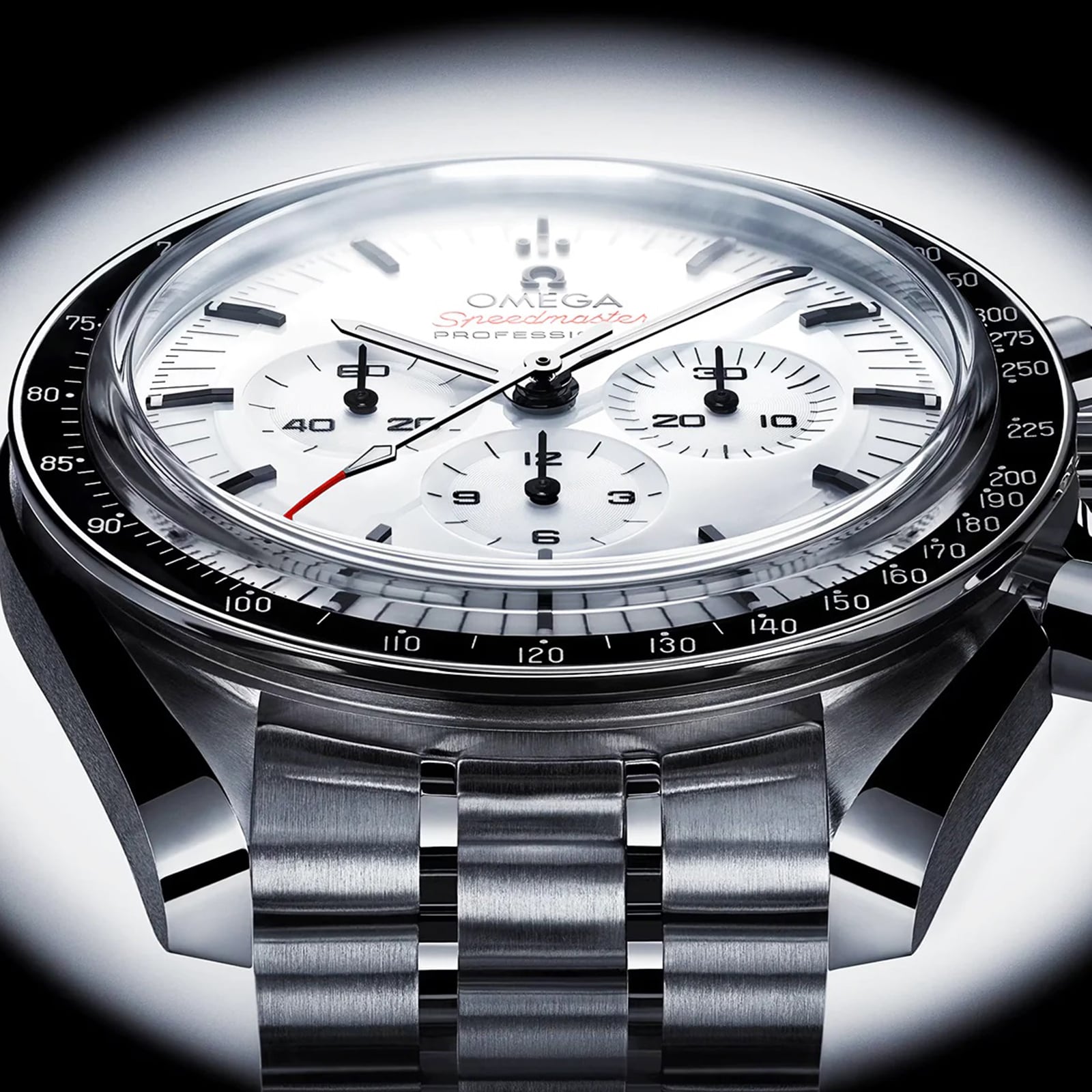 Close-up of the OMEGA Speedmaster Moonwatch Professional, showcasing a white dial, black bezel, three subdials, stainless steel bracelet, and powered by the precise Omega 3861 calibre.