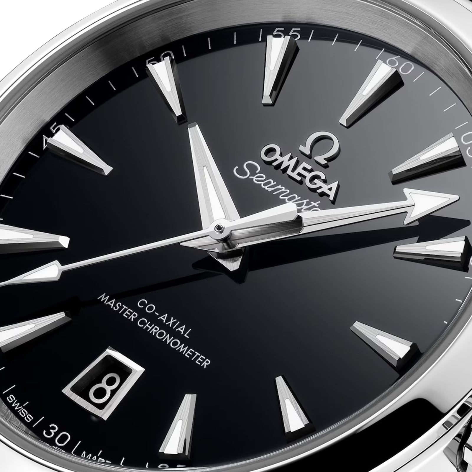 Close-up of an OMEGA Seamaster Aqua Terra 150M watch with silver hour markers, date window at 6 o’clock, and Co-Axial Master Chronometer text on a sleek black dial.
