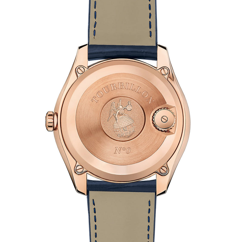 The back of the OMEGA De Ville Tourbillon in rose gold displays engraved text TOURBILLON N°0 and an emblem, complemented by a blue leather strap with visible stitching.