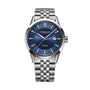 The Raymond Weil Freelancer Automatic features a blue dial, silver hour markers, date display at 3 o’clock, and a stainless steel link bracelet—showcasing Swiss watchmaking excellence.