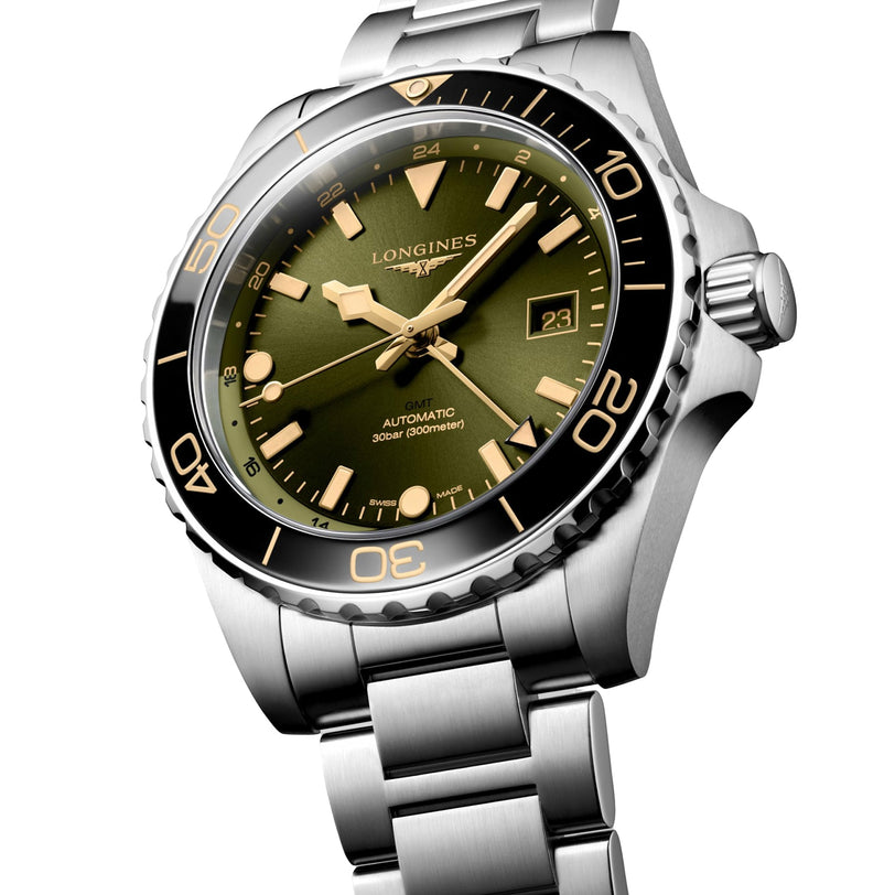 The Longines Hydroconquest features a silver stainless steel case, green dial, black bezel, date display, luminous markers, automatic movement, and is water resistant.