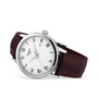 The Tissot Classic Dream features a white dial with black Roman numerals, date display, Swiss quartz movement, and a brown leather strap.