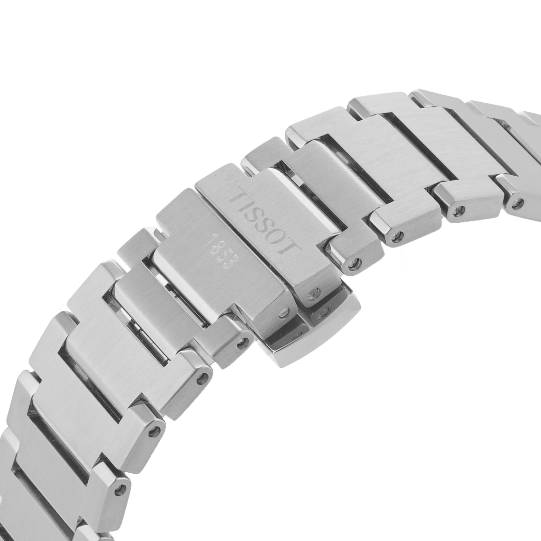Close-up of a stainless steel Tissot PRX Powermatic 80 bracelet with a clasp engraved TISSOT 1853.