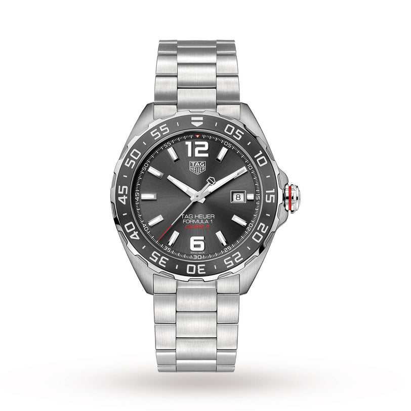 The TAG Heuer Formula 1 Date is a stainless steel wristwatch featuring a black dial, tachymeter bezel, date display at 3 o’clock, and a brushed metal bracelet.