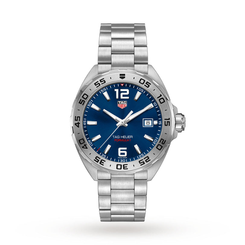 The TAG Heuer Formula 1 Date watch features a stainless steel case, blue dial, silver hour markers, date display at 3 o’clock, and a matching silver metal bracelet.
