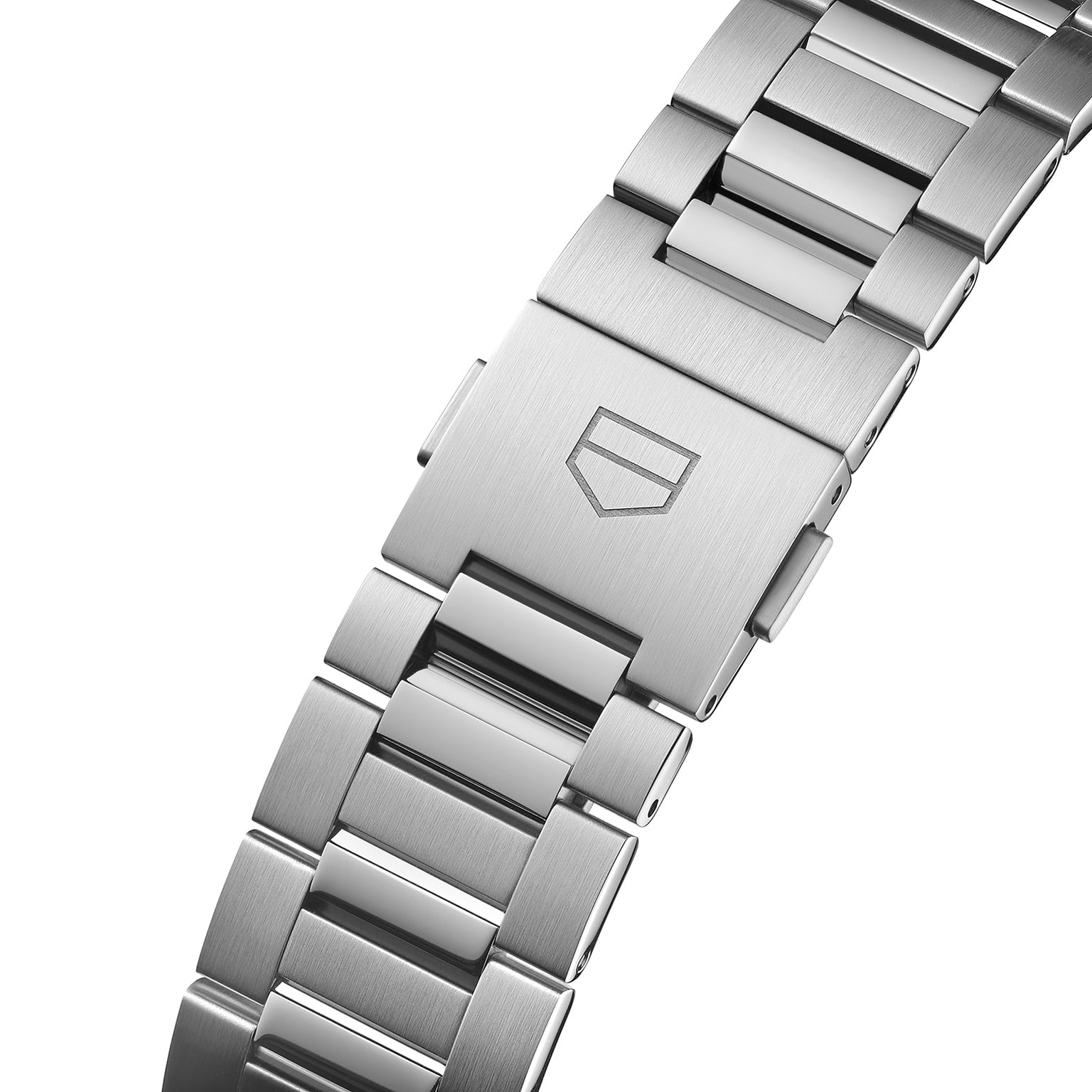 Close-up of the TAG Heuer Carrera Day-Date’s stainless steel bracelet and clasp, featuring a brushed finish and engraved geometric logo, underscoring the endurance and precision of its calibre 5 automatic movement.