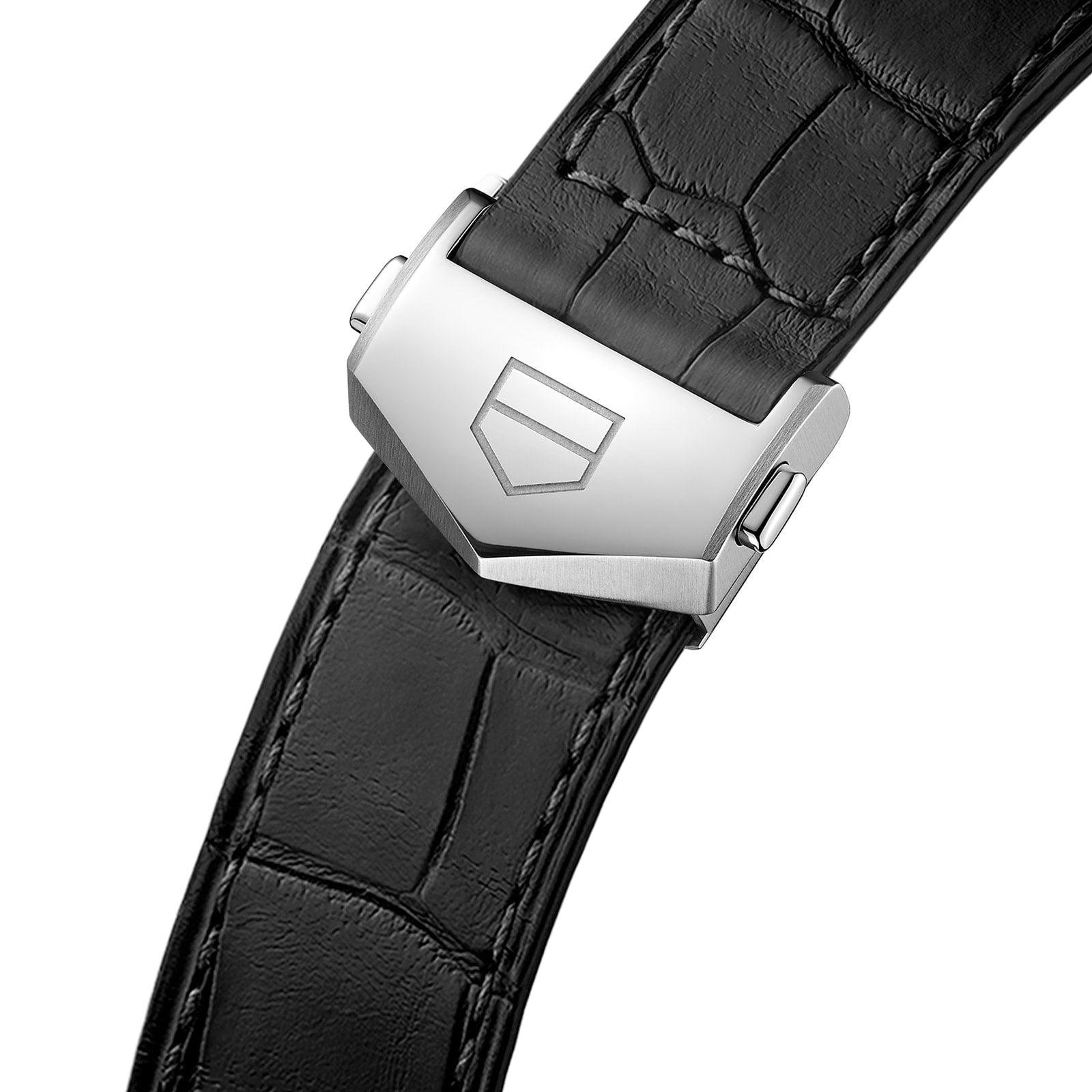 Close-up of a black leather TAG Heuer Carrera Date watch strap with a silver clasp engraved with a shield-shaped logo.
