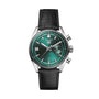 The TAG Heuer Carrera Chronograph features a green dial, silver markers, chronograph subdials, date window, and black leather strap, capturing the spirit of the Carrera Panamericana race against a white background.