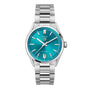 The TAG Heuer Carrera Date is a silver stainless steel wristwatch with a turquoise blue dial, silver markers and hands, calibre 7 automatic movement, date at 6 o’clock, and metal link bracelet. Inspired by the Panamericana race.