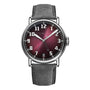 The H. Moser & Cie Heritage Dual Time features a burgundy fumé dial, silver numerals, date at 6 o’clock, and a gray leather strap—an ideal wristwatch for adventurous spirits.