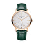 The Vacheron Constantin Patrimony Self-Winding is a limited edition wristwatch in 18K pink gold, featuring a silver dial with date at 6 o’clock, green leather strap, geometric patterns, Geneva Seal, and Vacheron Constantin branding.