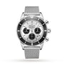 The Breitling Superocean Heritage B01 Chronograph 44 features a silver mesh band, black bezel, and three subdials on a white dial—a stylish, water-resistant watch perfect for any occasion.