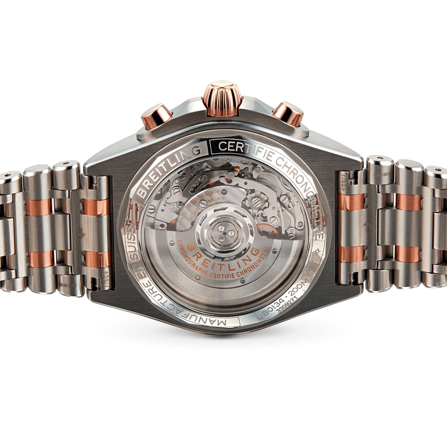 Back view of a Breitling Chronomat B01 42 wristwatch featuring its exposed automatic movement through a transparent case back and a two-tone metal bracelet.