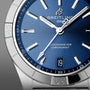 Close-up of the Breitling Chronomat Automatic 36, featuring a blue dial, silver hour markers and hands, date display at 6 o’clock, stainless steel bezel, and COSC-certified Breitling 10 calibre.