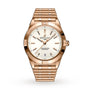 The Breitling Chronomat Automatic 36 features a gold case, white dial with gold markers and hands, date display at 6 o’clock, and signature Rouleaux linked bracelet for a classic look.