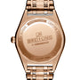 Close-up of the back of a Breitling Chronomat Automatic 36, showing engraved brand name, model, and COSC certified details. The iconic Rouleaux bracelet enhances its classic sophistication in rose gold.