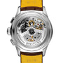 Close-up of the Premier B25 Datora 42 by Breitling, showcasing its transparent caseback that reveals the intricate mechanical movement and inner workings, complemented by a yellow leather strap.