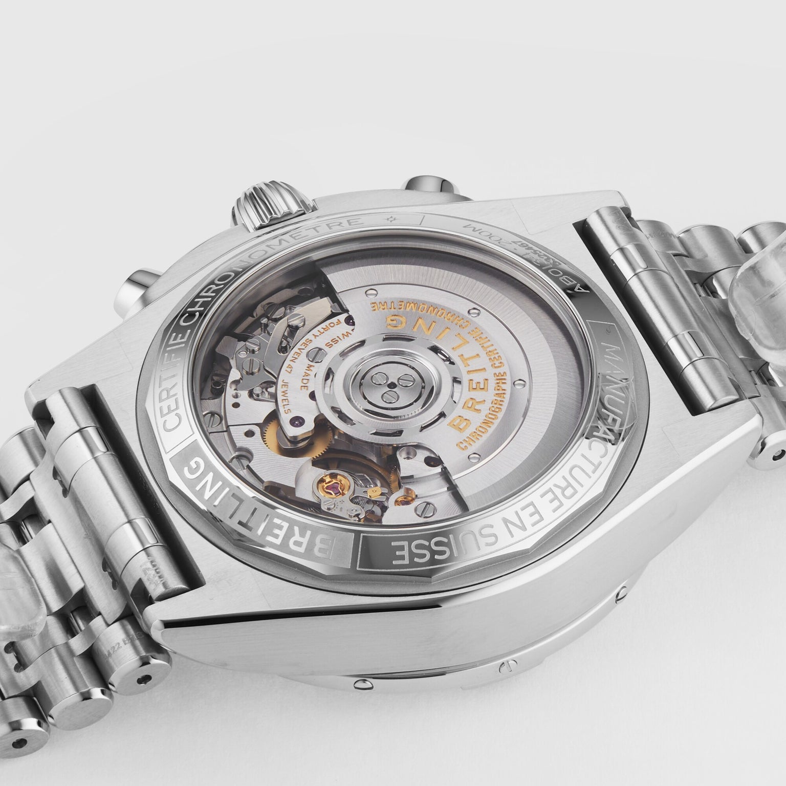 Close-up of the back of the Breitling Chronomat B01 42, showcasing its exposed mechanical movement and engraved stainless steel case details.