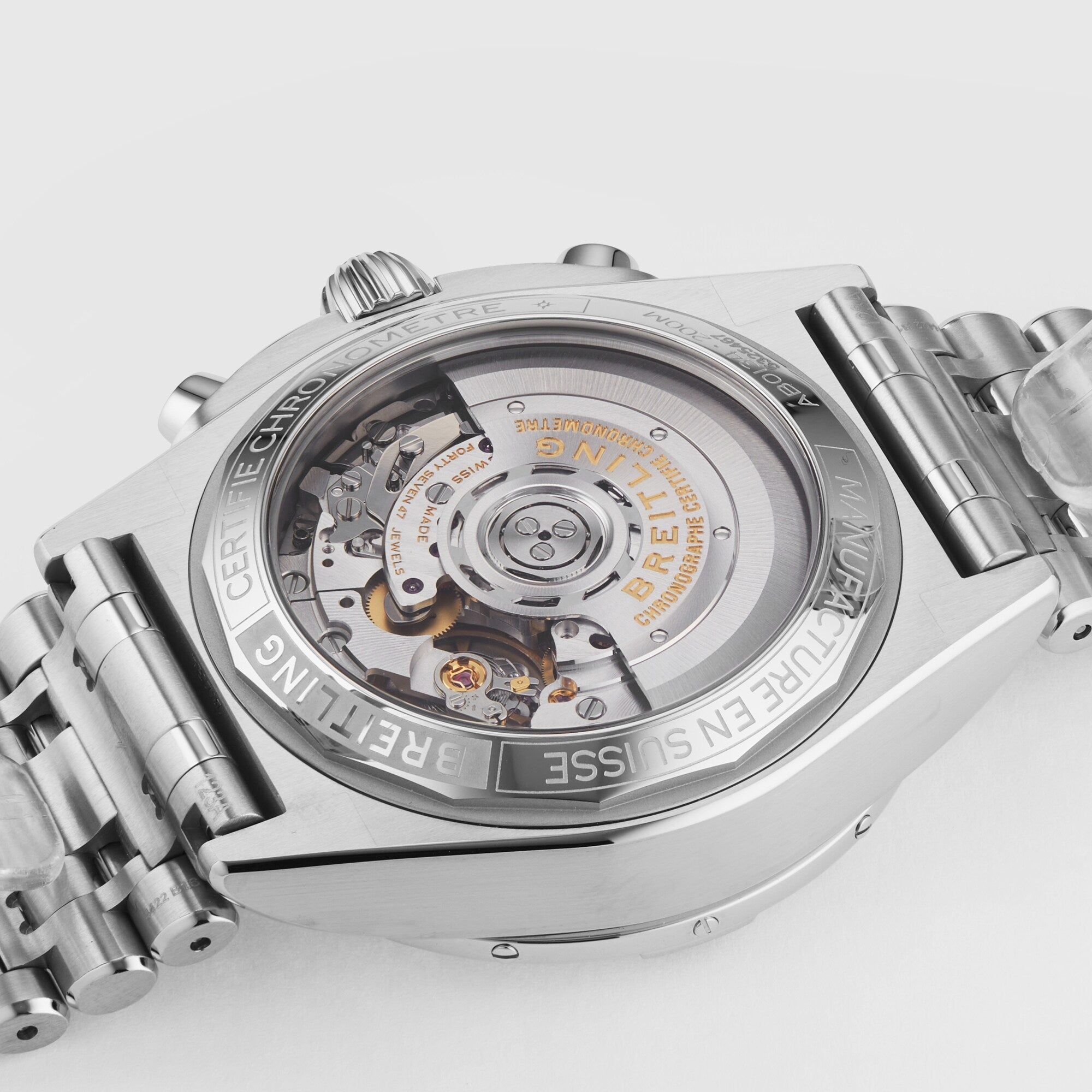 Close-up of the back of the Breitling Chronomat B01 42, showcasing its exposed mechanical movement and engraved stainless steel case details.