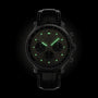 The Breitling Navitimer B01 Chronograph 43 features a black dial, leather strap, luminous green markers and hands, and three subdials, all showcased against a dark background.
