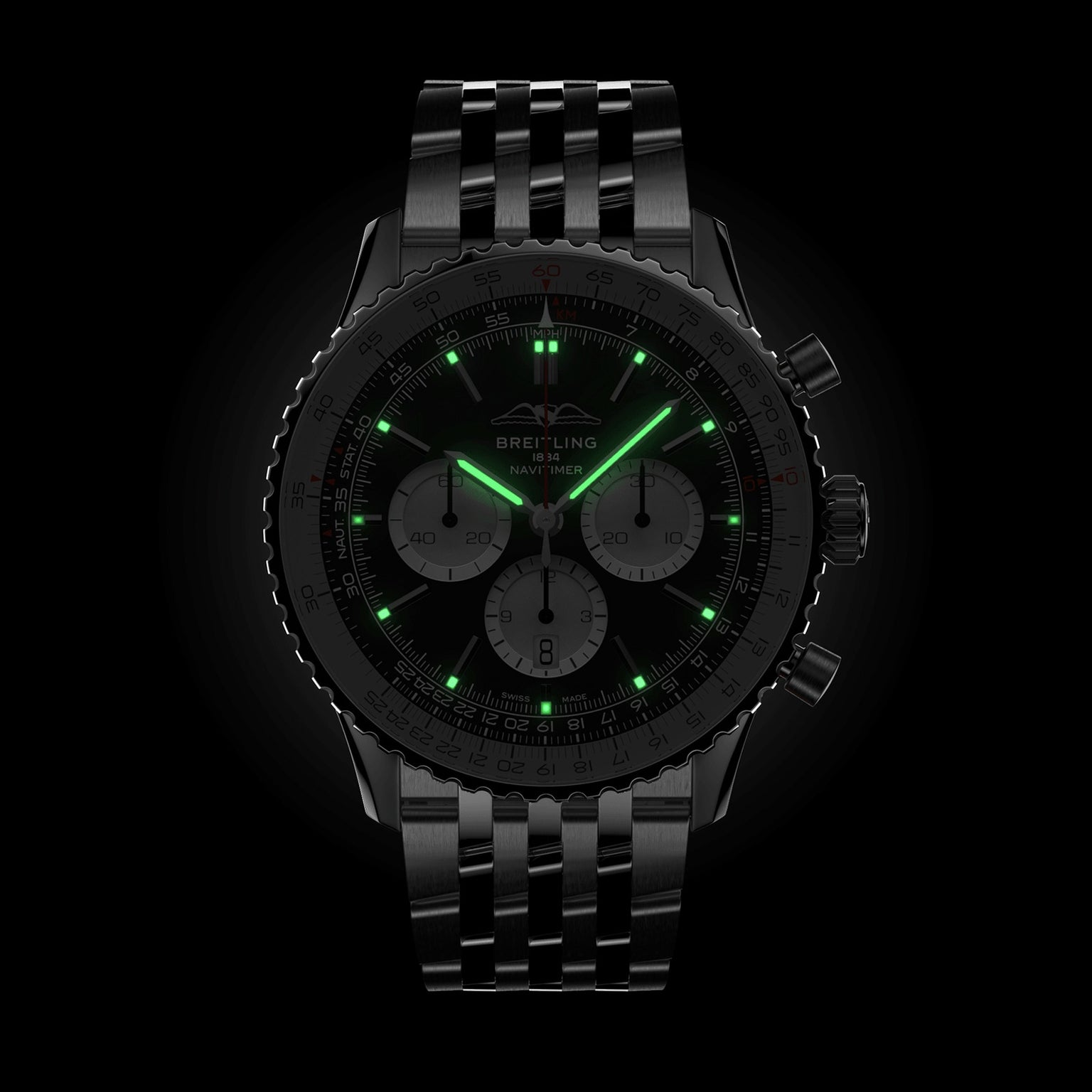 A black Breitling Navitimer B01 Chronograph 46 with a metal bracelet and green luminous hands and hour markers is displayed against a black background.